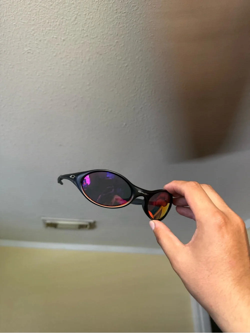 Black Sunglasses with Mirrored Red-Orange Lenses oakley